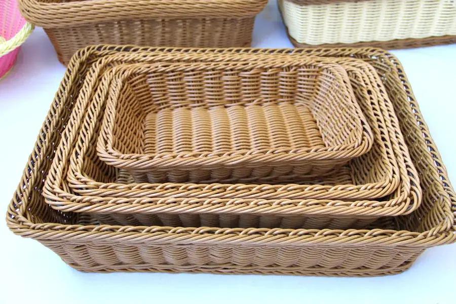 Rectangular hand-woven imitation rattan wicker storage basket set in tan, nested for kitchen organization