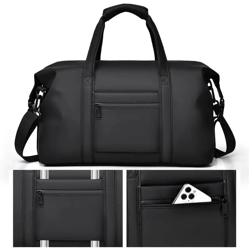 Large black travel duffel bag with top handles, detachable shoulder strap, front zip pocket and side phone pocket.