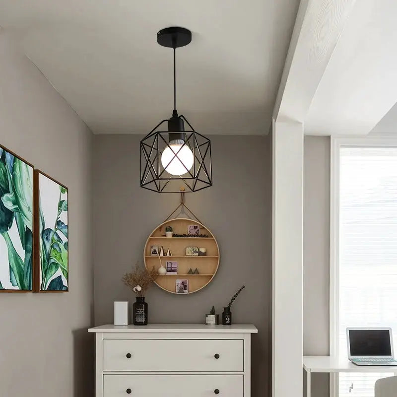 Modern LED pendant light with black metal geometric cage and gold interior accents