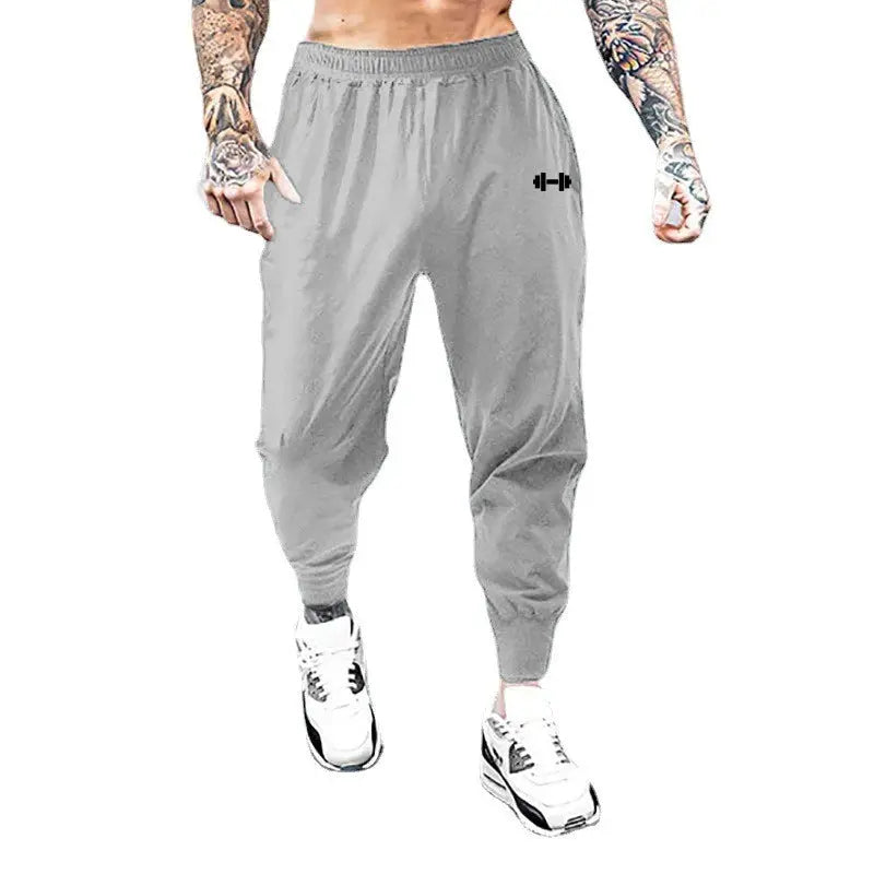 Men's gym pants by Simples Market, light gray ultra-thin quick-dry joggers with elastic waist and cuffed ankles.