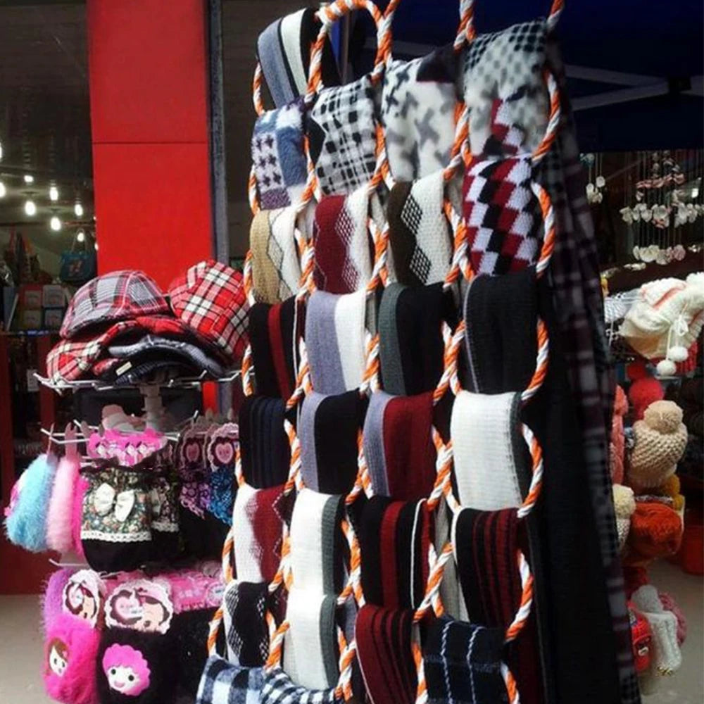 28-hole scarf holder rack with rattan weave and orange rope hanger, displaying plaid and knit scarves.