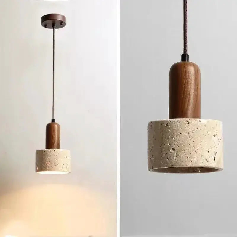 Pendant lamp with beige travertine-style shade and wooden top for dining or kitchen island.