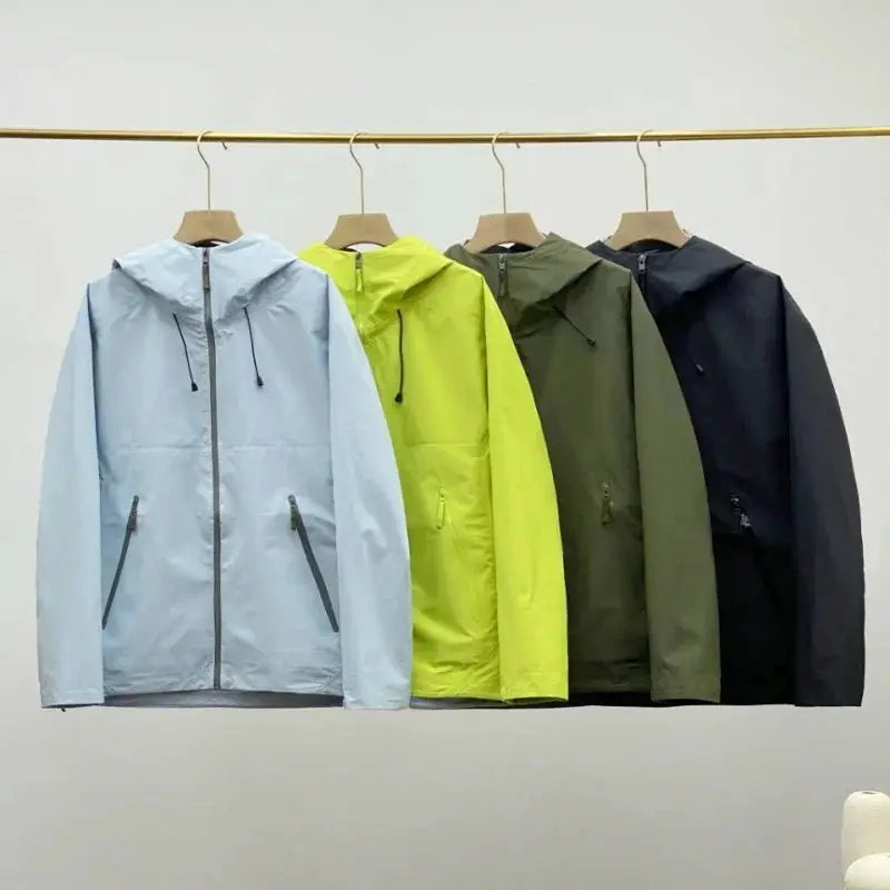 Men's windproof soft shell outdoor jackets by Simples Market in light blue, lime, olive, and black on hangers (4-pack).