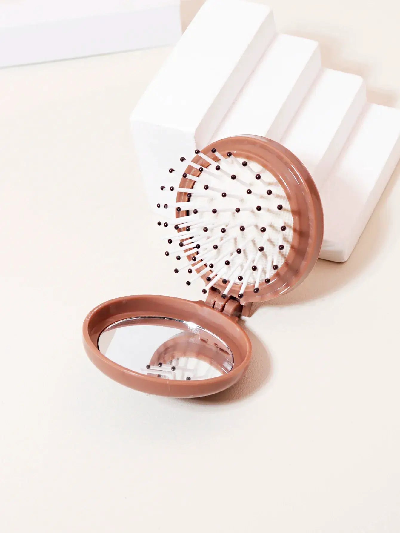 Mini folding hair brush with mirror, pink-brown plastic, anti-static, travel size for real hair wigs by Simples Market