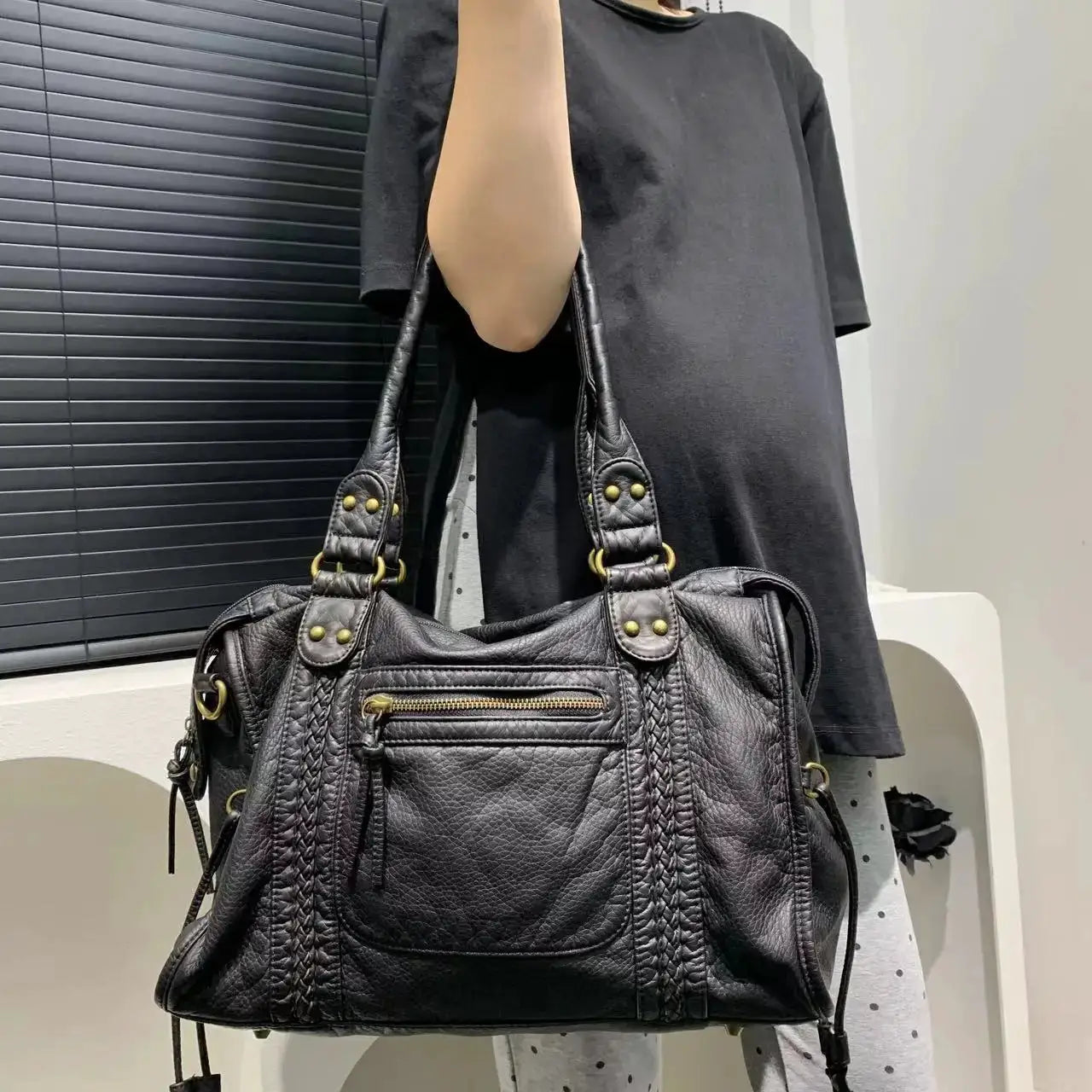 Y2K Spicy Girl One-Shoulder Crossbody Bag in black washed leather with braided front, brass hardware, and large capacity.