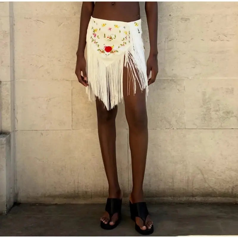 Skirt by Simples Market; white patchwork fringe mini skirt with floral front panel and fringe hem.