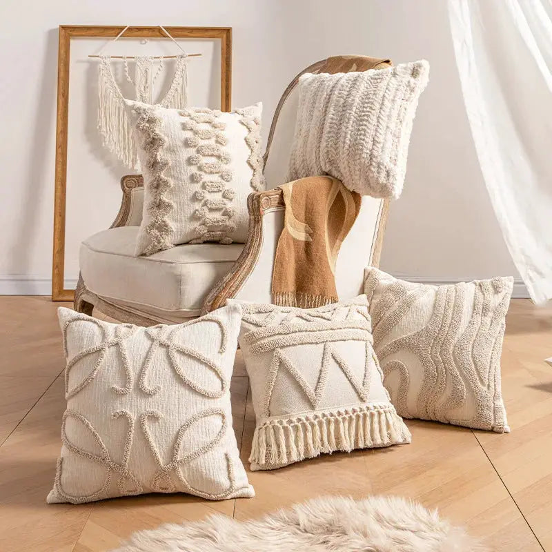 Beige bohemian pillow covers; five textured-knit pillow covers displayed on floor and chair.