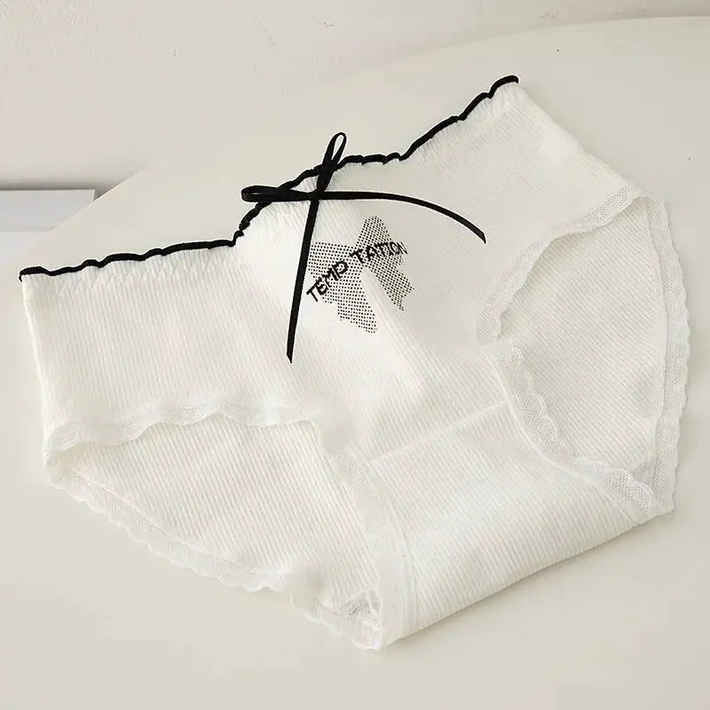 Women's white ribbed lace briefs with scalloped edges and black bow detail.
