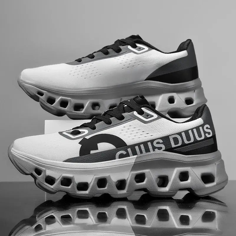 Men's running shoes with white breathable mesh upper, black overlays, and a chunky cushioned sole.