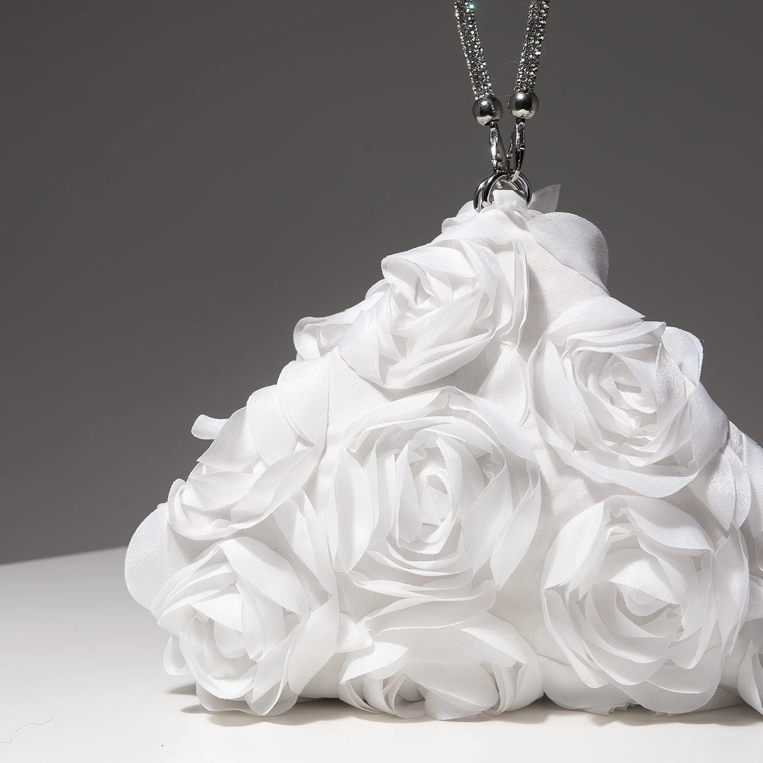 Mini white floral rosette purse on a silver chain necklace, bridal party accessory.