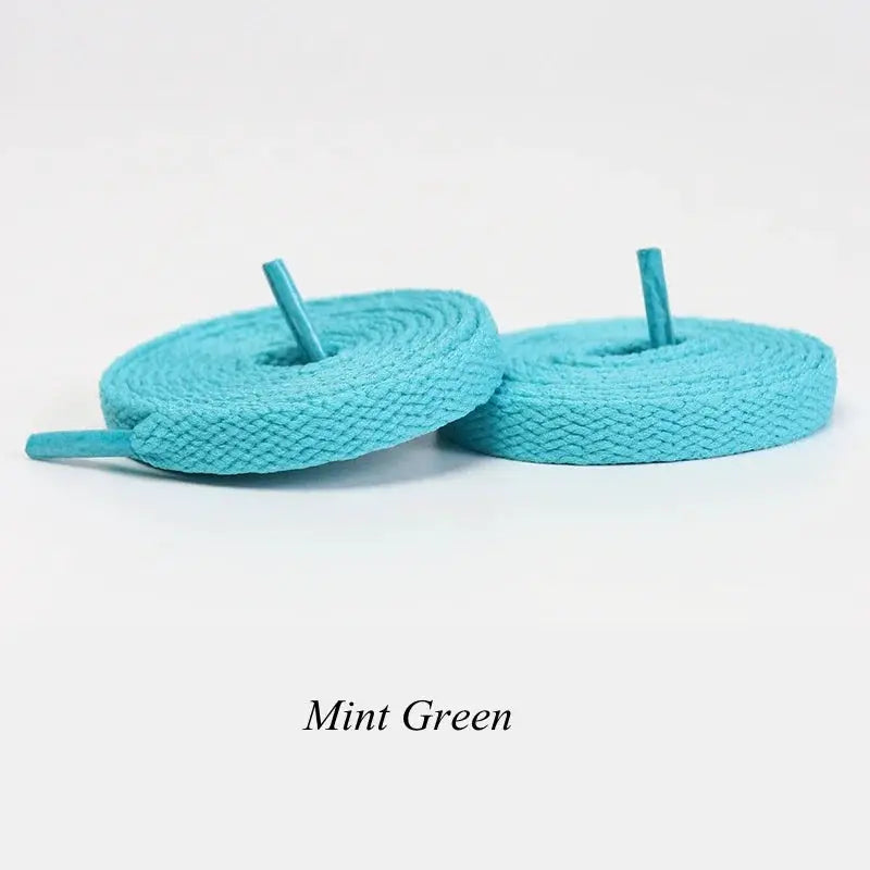 Flat mint green shoelaces, 1 pair, suitable for sneakers and casual wear.