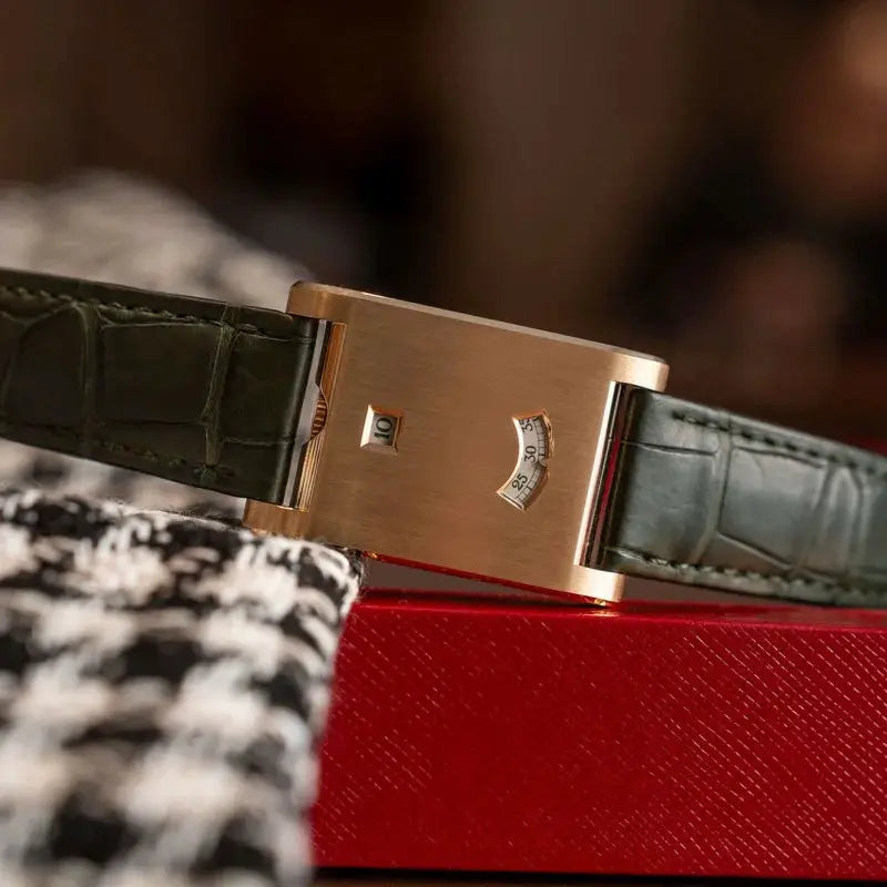 Watch with rose-gold square case and green leather strap, quartz movement