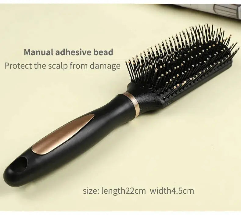 Simples Market Air Bag Anti-Static Hair Brush, black plastic massager with bronze trim and nylon bristles, 22 cm long.