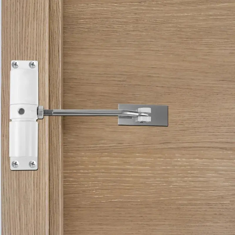 30kg adjustable tension door closer on wooden door; white housing and metal arm