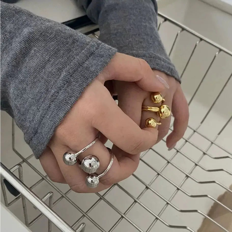 Exaggeration punk metal ring set for women with irregular three-layer ball design in silver and gold tones, adjustable
