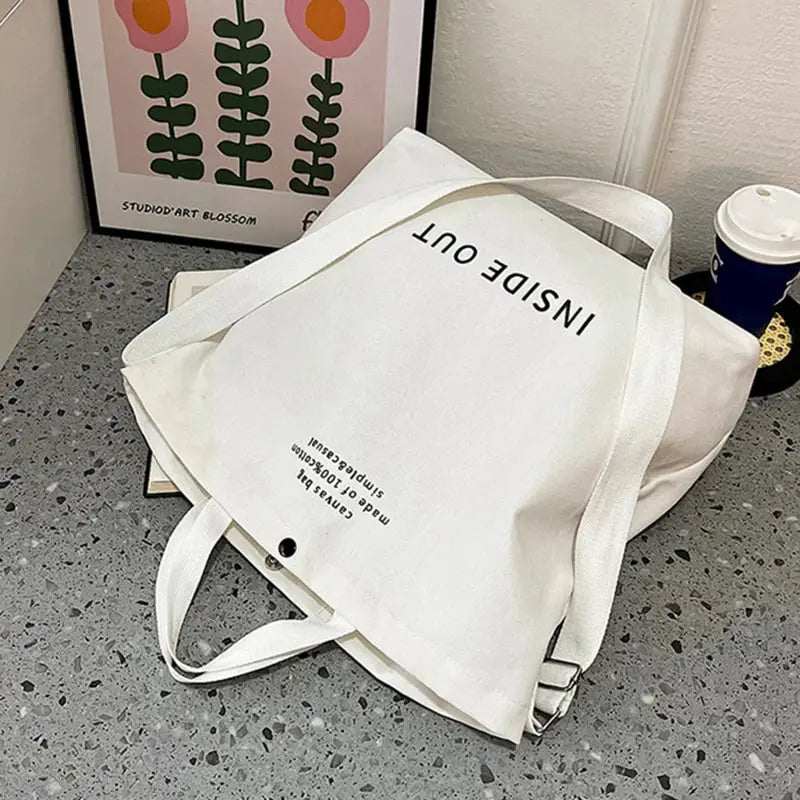 White canvas crossbody bag with long strap, large capacity tote for students