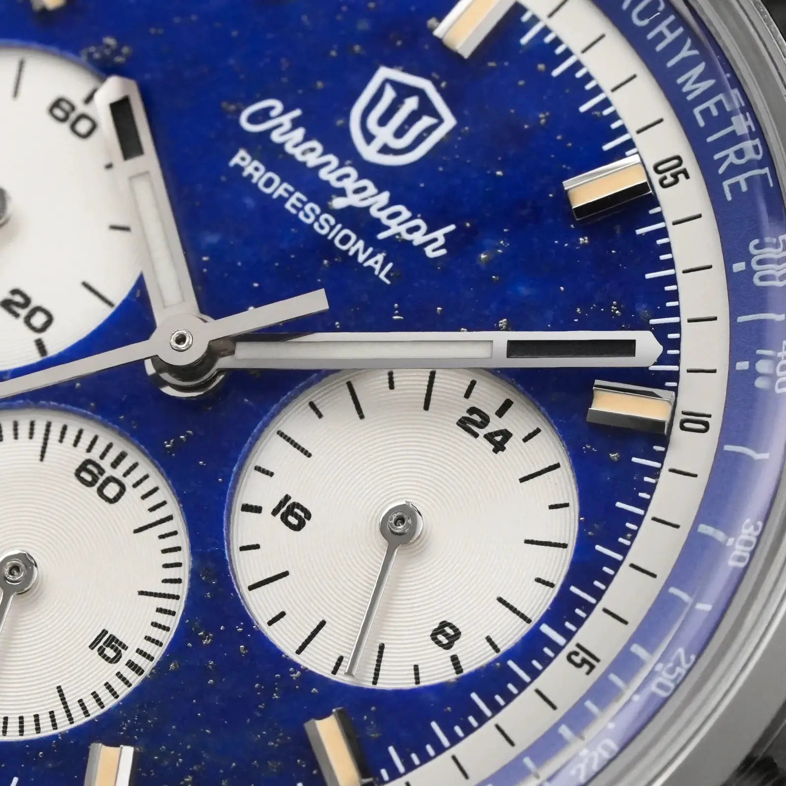 Chronograph watch with blue dial, white subdials, and silver hands in a stainless steel case.