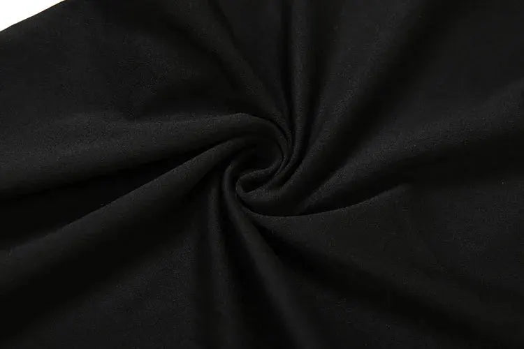 Jumpsuit fabric close-up in black; smooth, soft textile material
