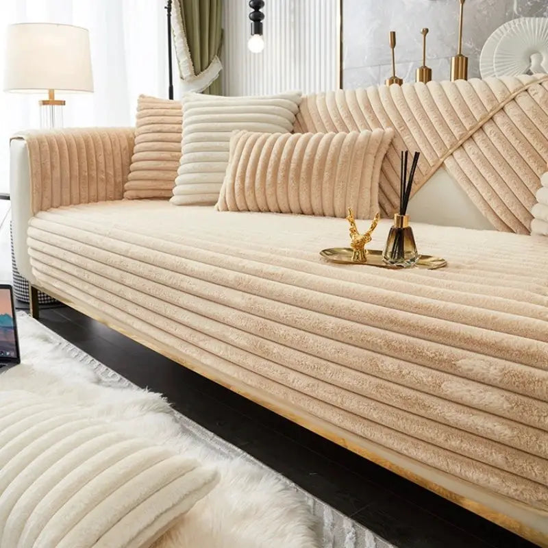Thick plush stripe faux rabbit fur sofa cover with non-slip backing on beige couch with matching cushions