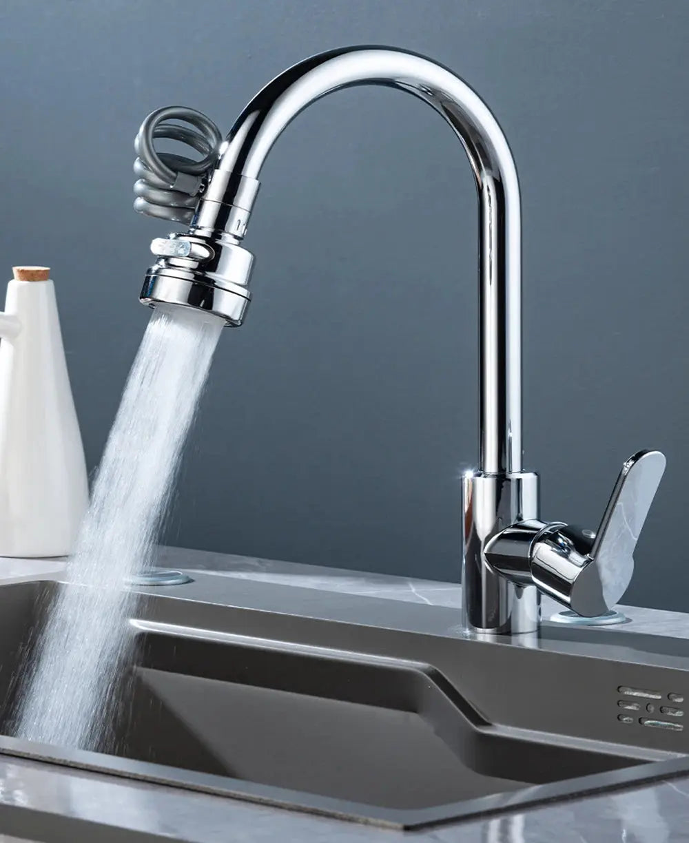 Chrome kitchen sink faucet with 360-degree swivel spray head and pull-out hose, single-handle.