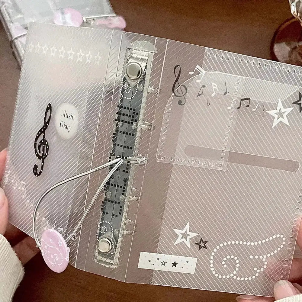 M5 music-themed binder notebook by Simples Market; silver twill, tri-fold with tie closure and photo album organizer