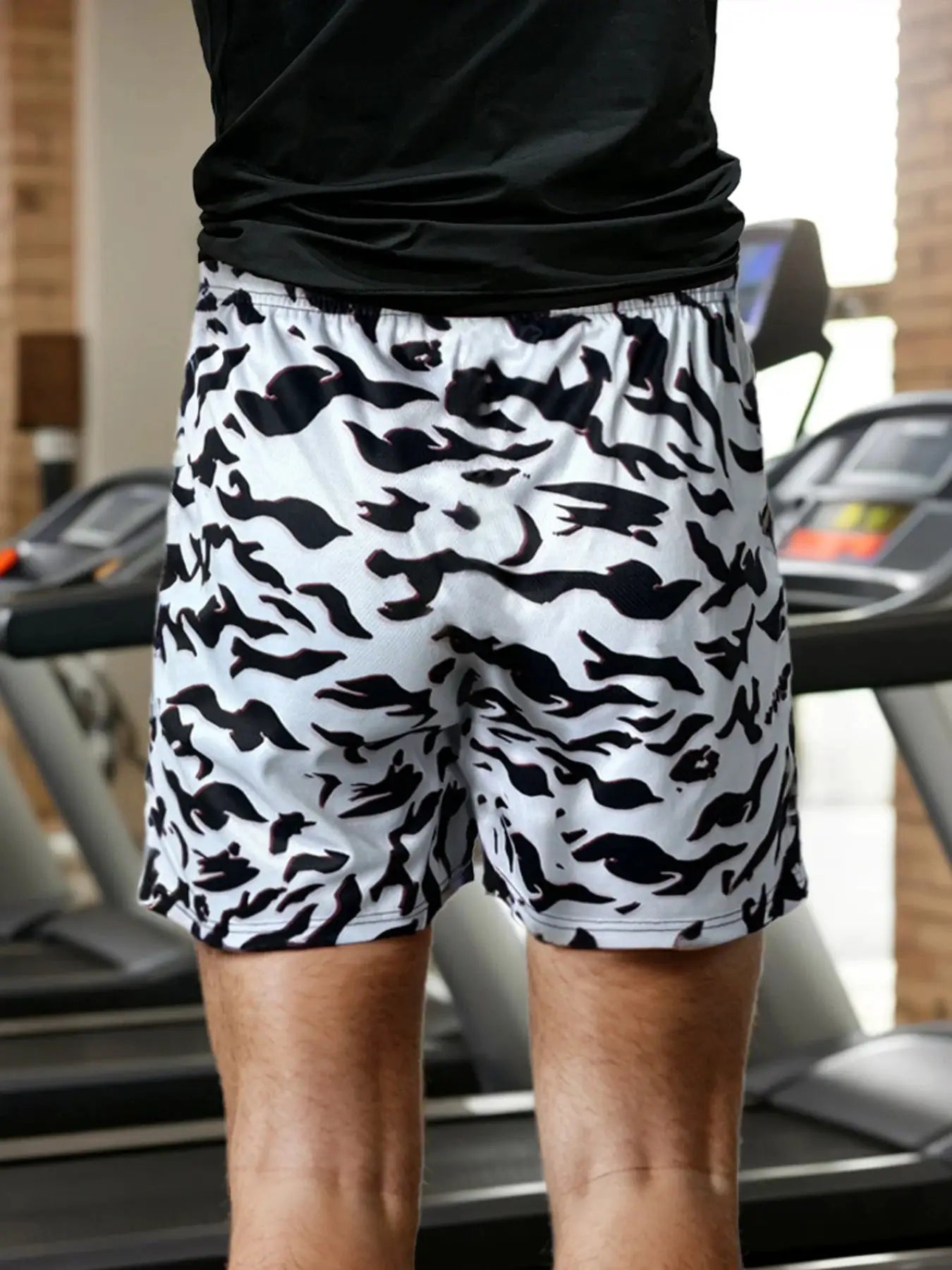 Men's anime-pattern running shorts, white with black camo print, quick-dry fabric.