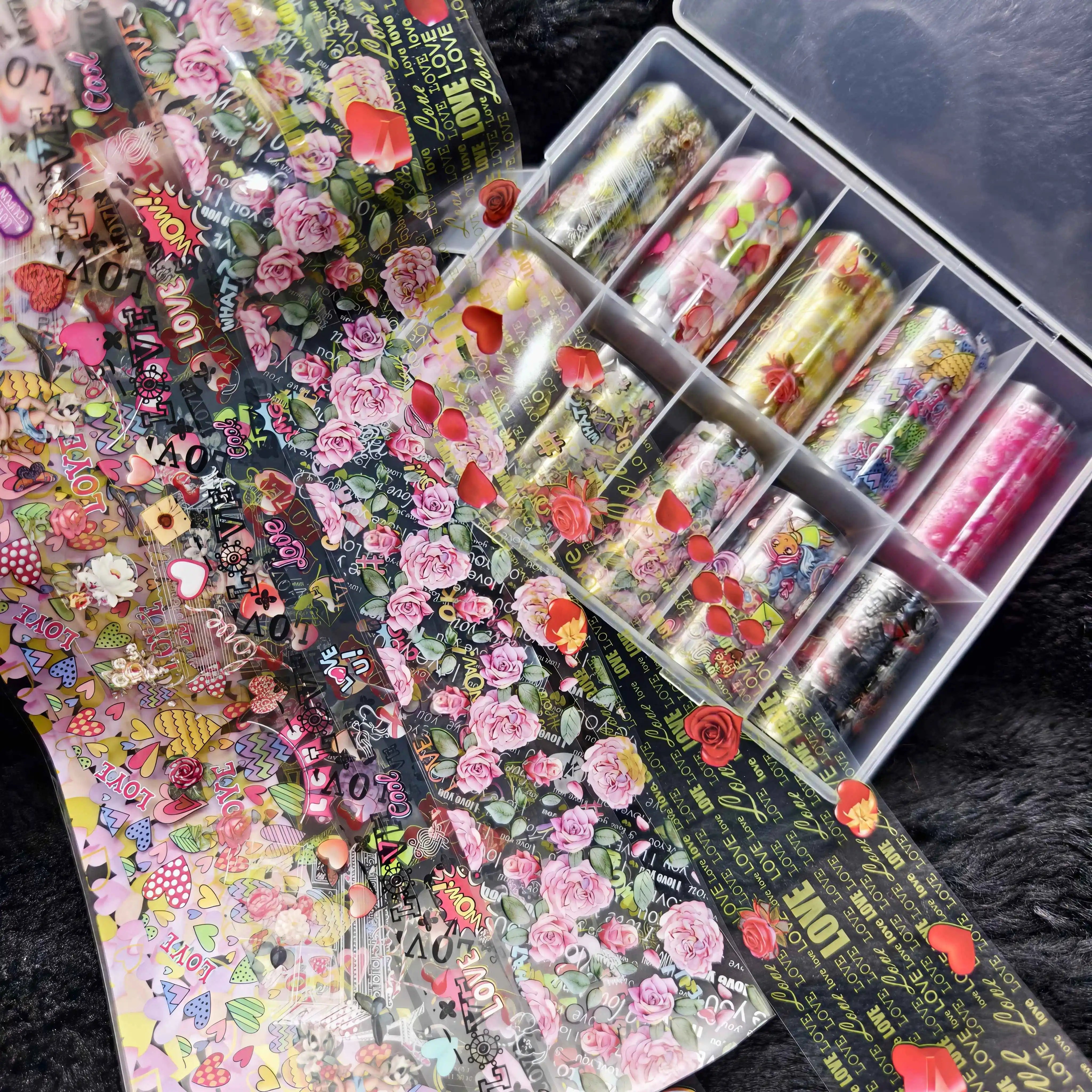Nail foil stickers set by Simples Market, 10 rolls of floral rose designs with gold lettering on clear transfer sheets