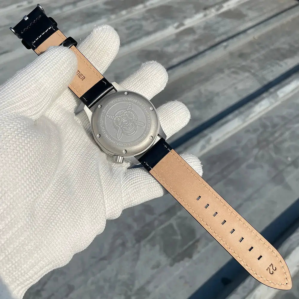 STEELFLIER SF752 mechanical wristwatch with tan leather strap and engraved screw-down case back.