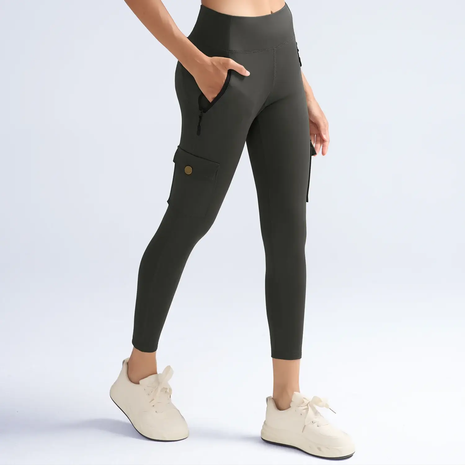 Olive cargo-pocket leggings for women with high waist, thigh pocket and side zip pockets, athletic fit.