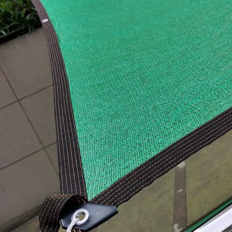 Sunshade net, green HDPE fabric with black border and grommet corner for garden or pool shading