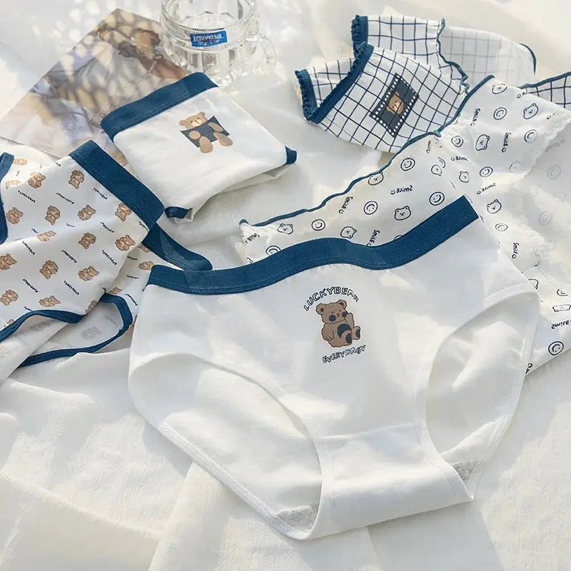 5-piece cotton panties set with bear cartoon prints and blue trim on white fabric