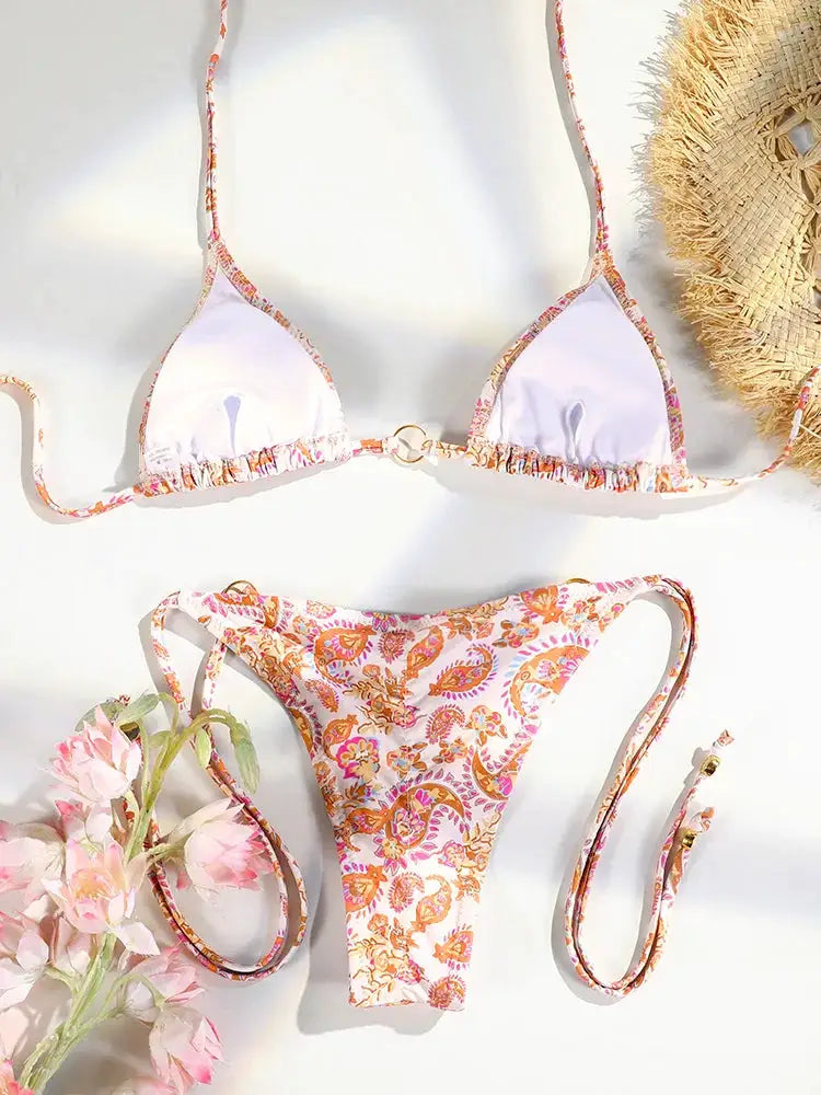 Triangle bikini set with floral paisley print, lavender top and matching printed bottom with string ties