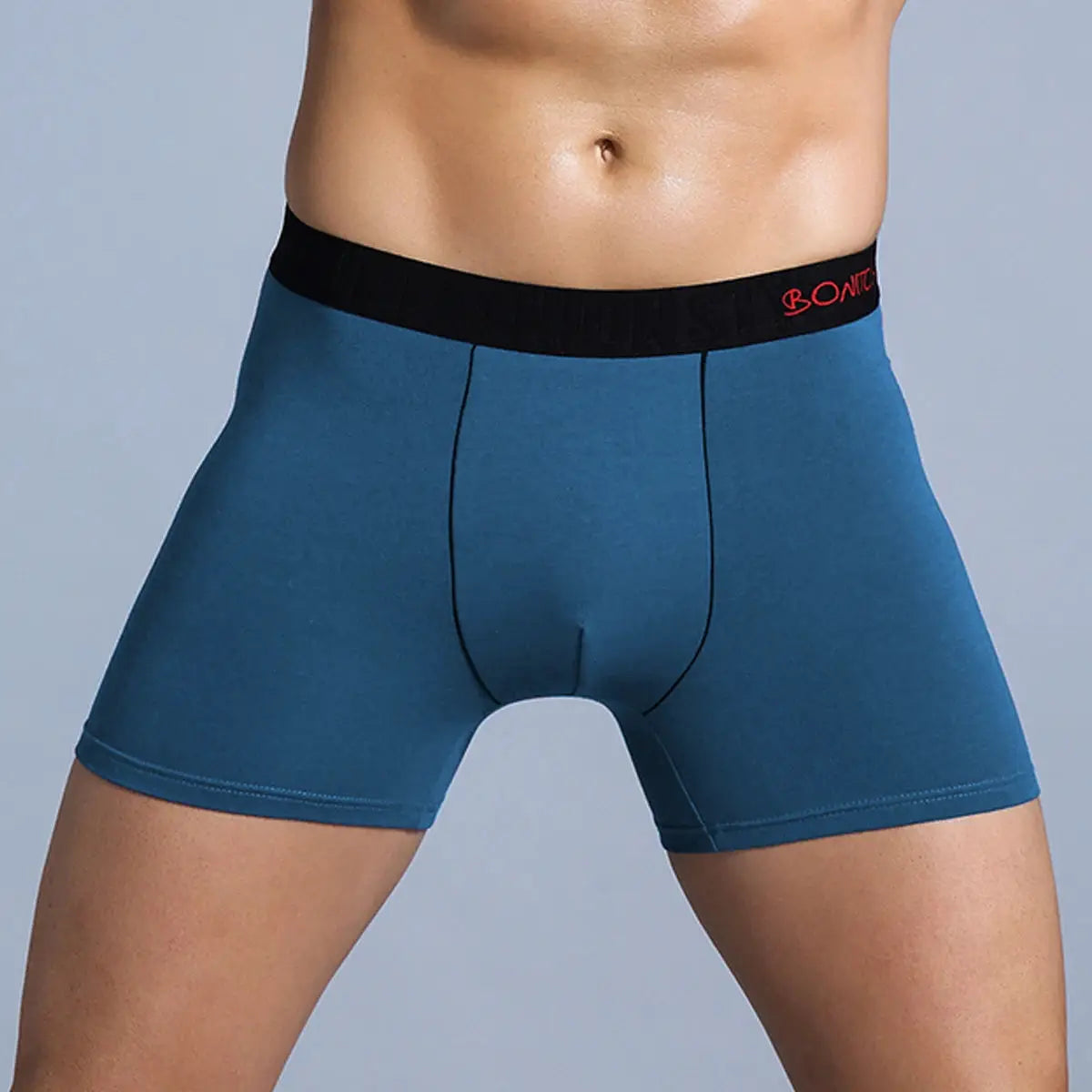 Men's blue cotton boxer shorts with black elastic waistband and red logo