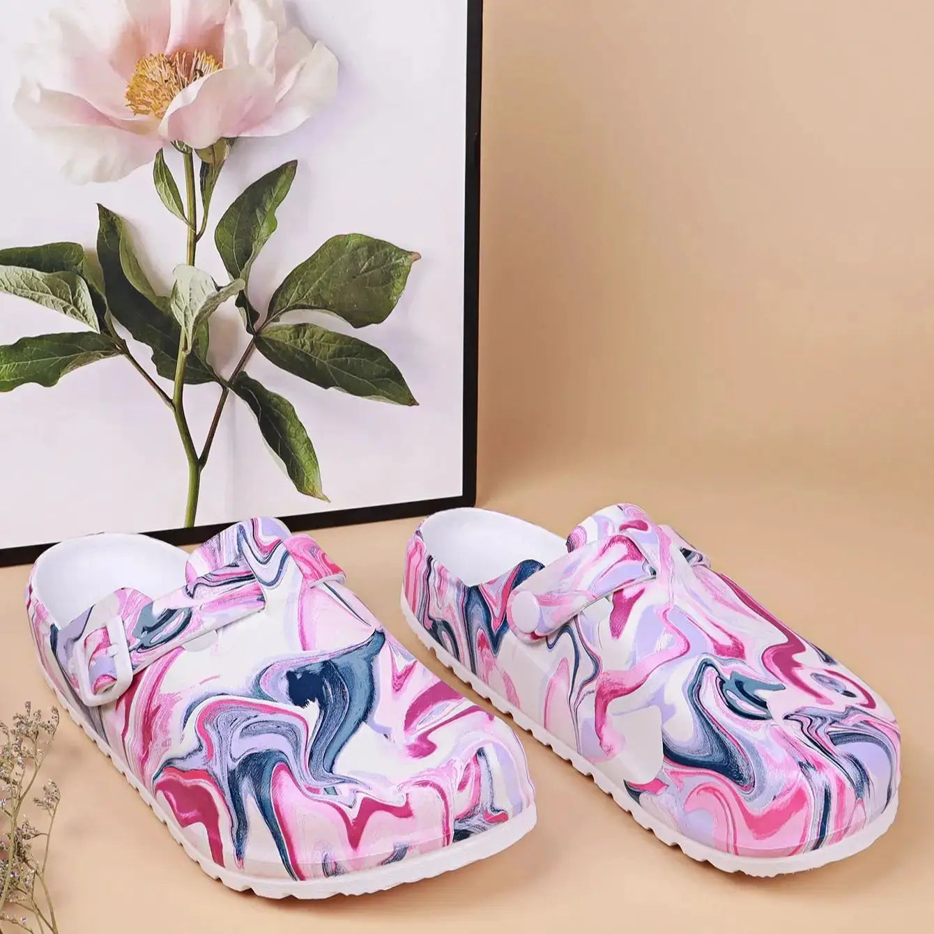 Women’s marbled EVA garden clogs in pink/white with blue swirls; slip-on, waterproof, lightweight with a white sole.