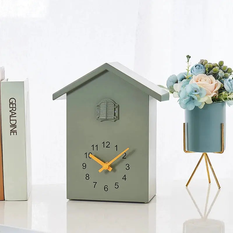 Cuckoo quartz wall clock 20x25cm in olive green, birdhouse-style with orange hands