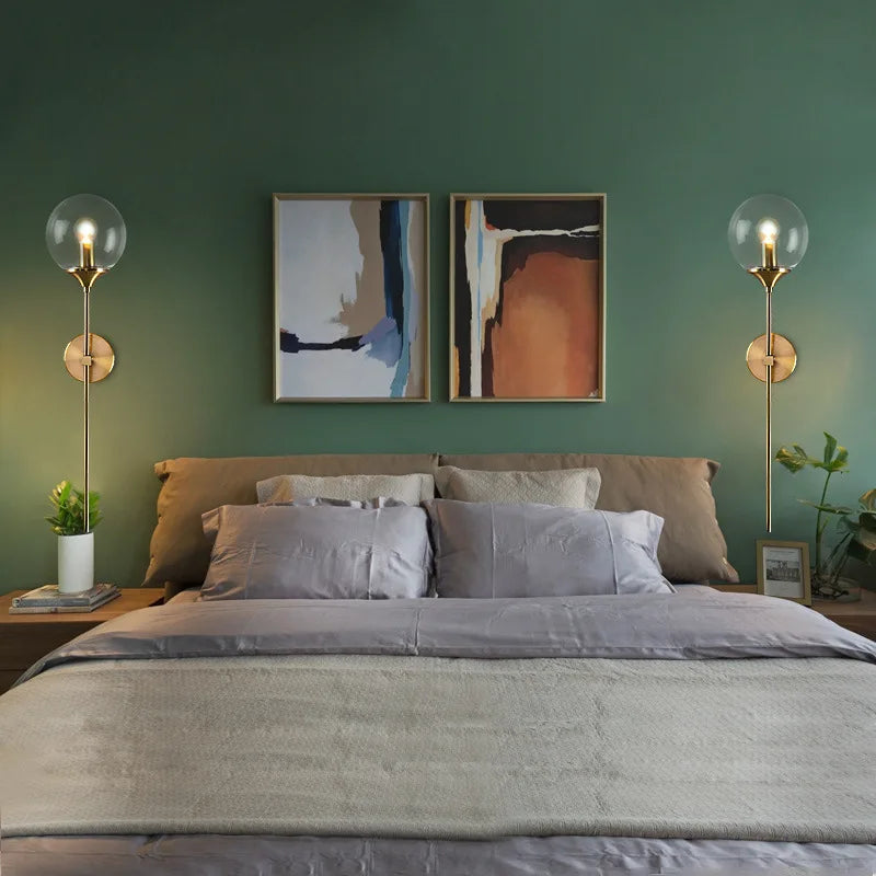 Simples Market modern gold glass ball wall lamp sconces, pair flanking bed.