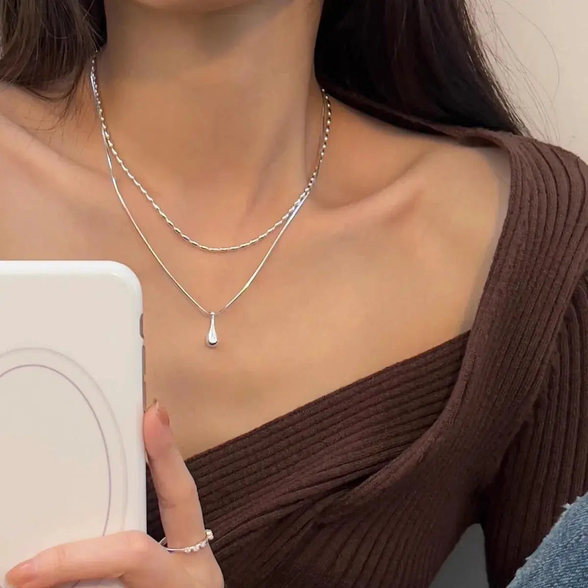 Sterling silver double-layer collar necklace for women with a teardrop pendant.