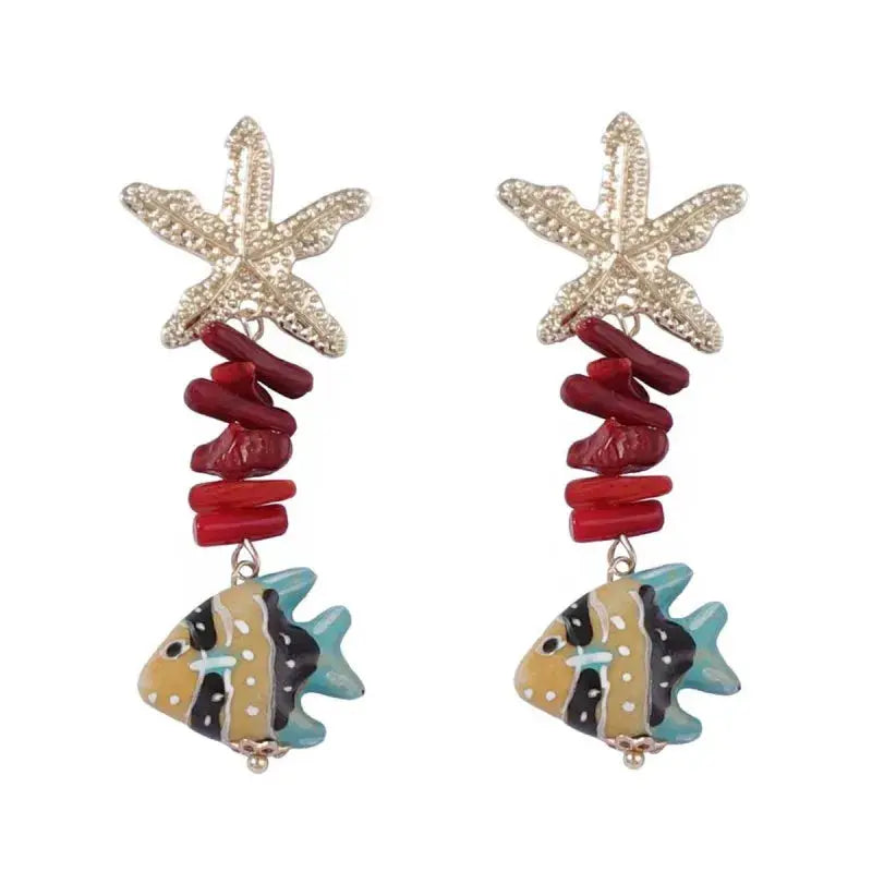 Marine-themed drop earrings by Simples Market with starfish topper, red coral beads, turquoise fish charm