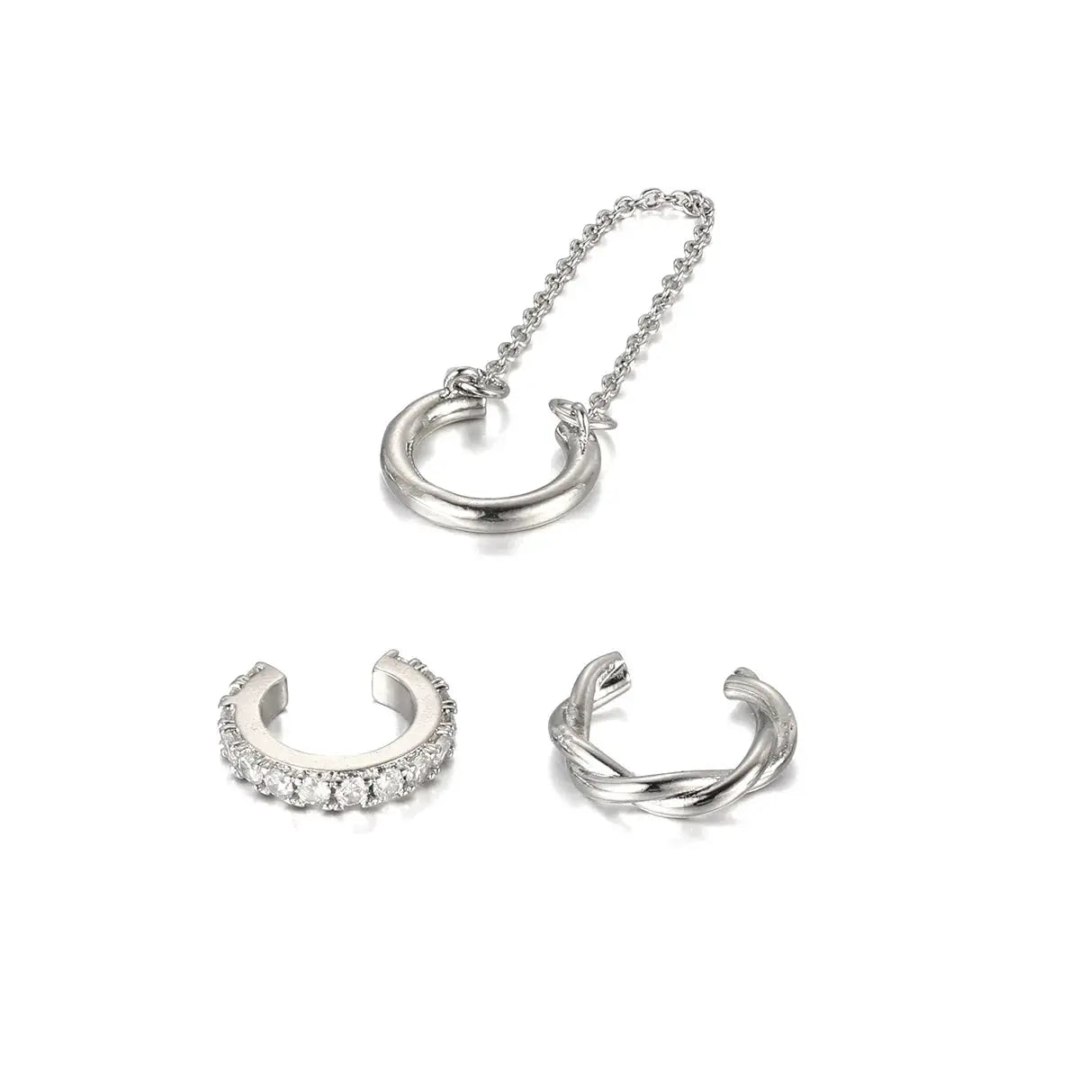 3-piece silver ear cuff set; non-piercing clip earrings with crystal pave hoop, twisted cuff, and crescent cuff.