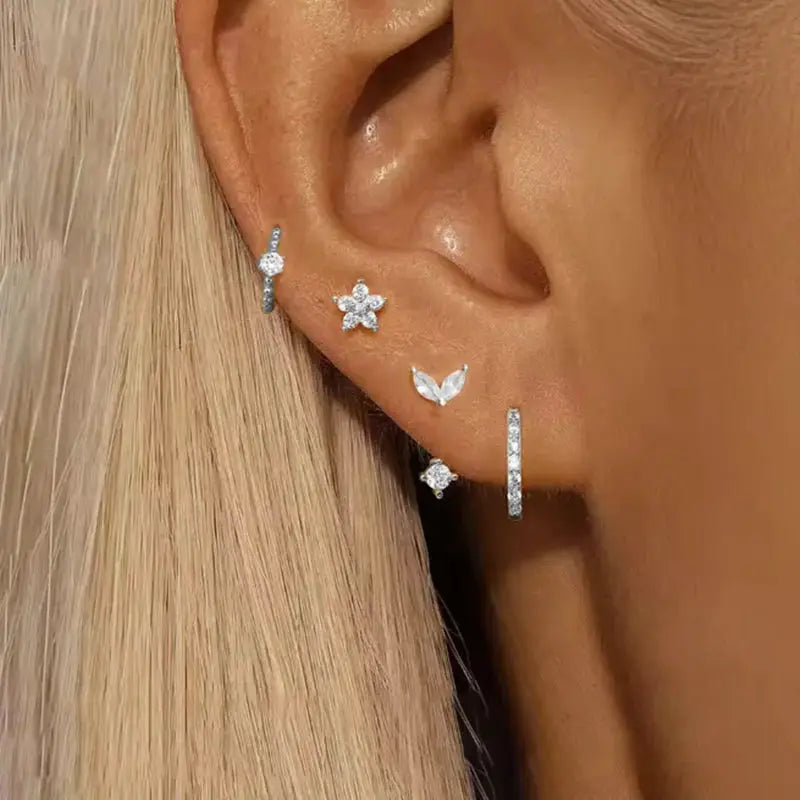 4-piece Simples Market zircon hoop earring set for women in silver-tone finish, includes star, flower, leaf studs and huggie hoops