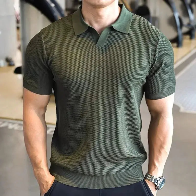 Men's olive-green knitted polo shirt with textured knit pattern, polo collar, and short sleeves.
