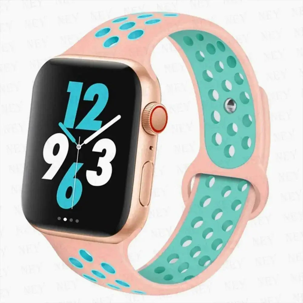Silicone sport strap for Apple Watch by Simples Market, pink exterior with turquoise perforated interior, Pride bracelet.