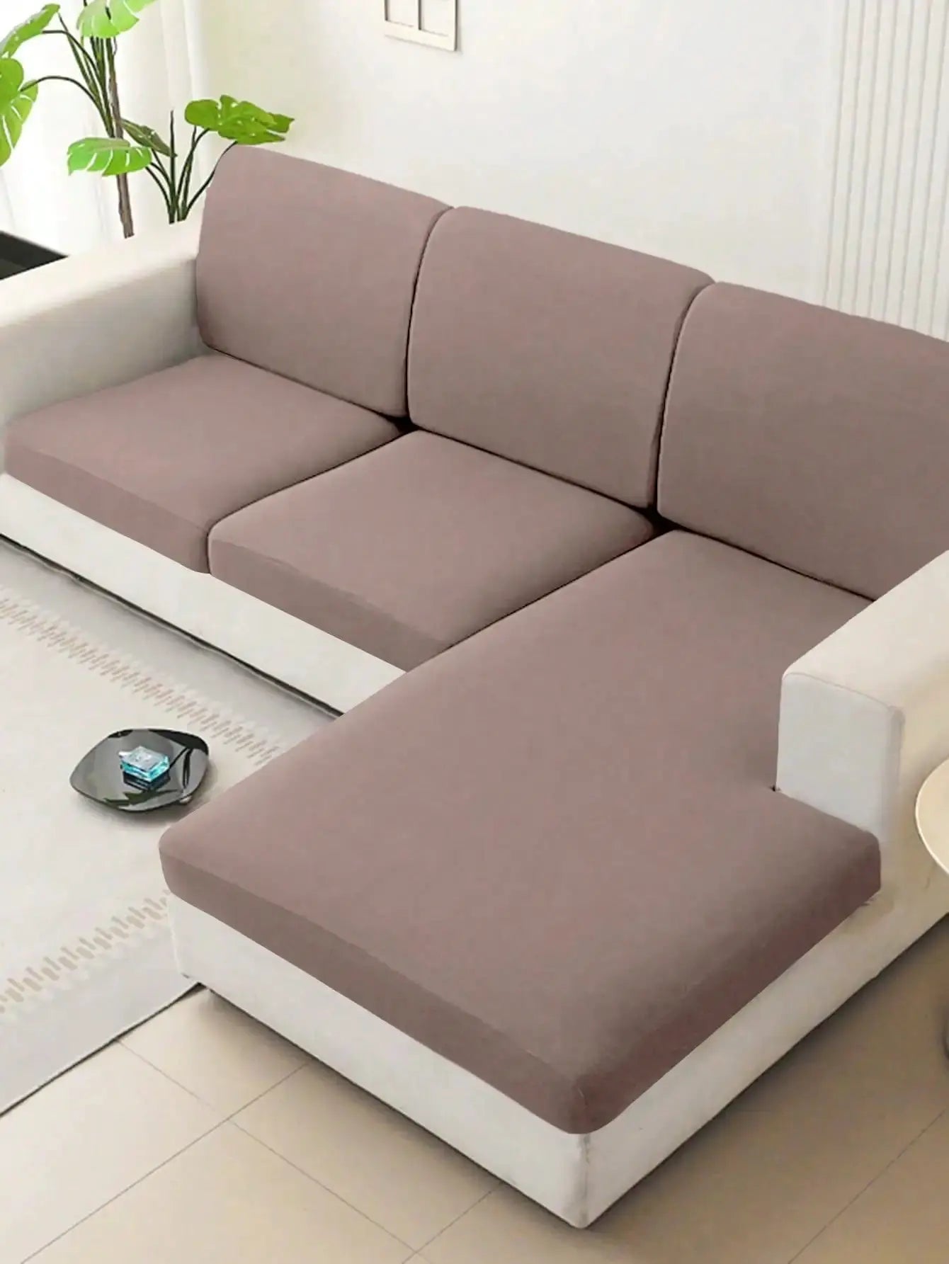 Solid milk-silk elastic sofa cover in dusty pink on a white sofa; universal four-season slipcover, anti-slip, washable.