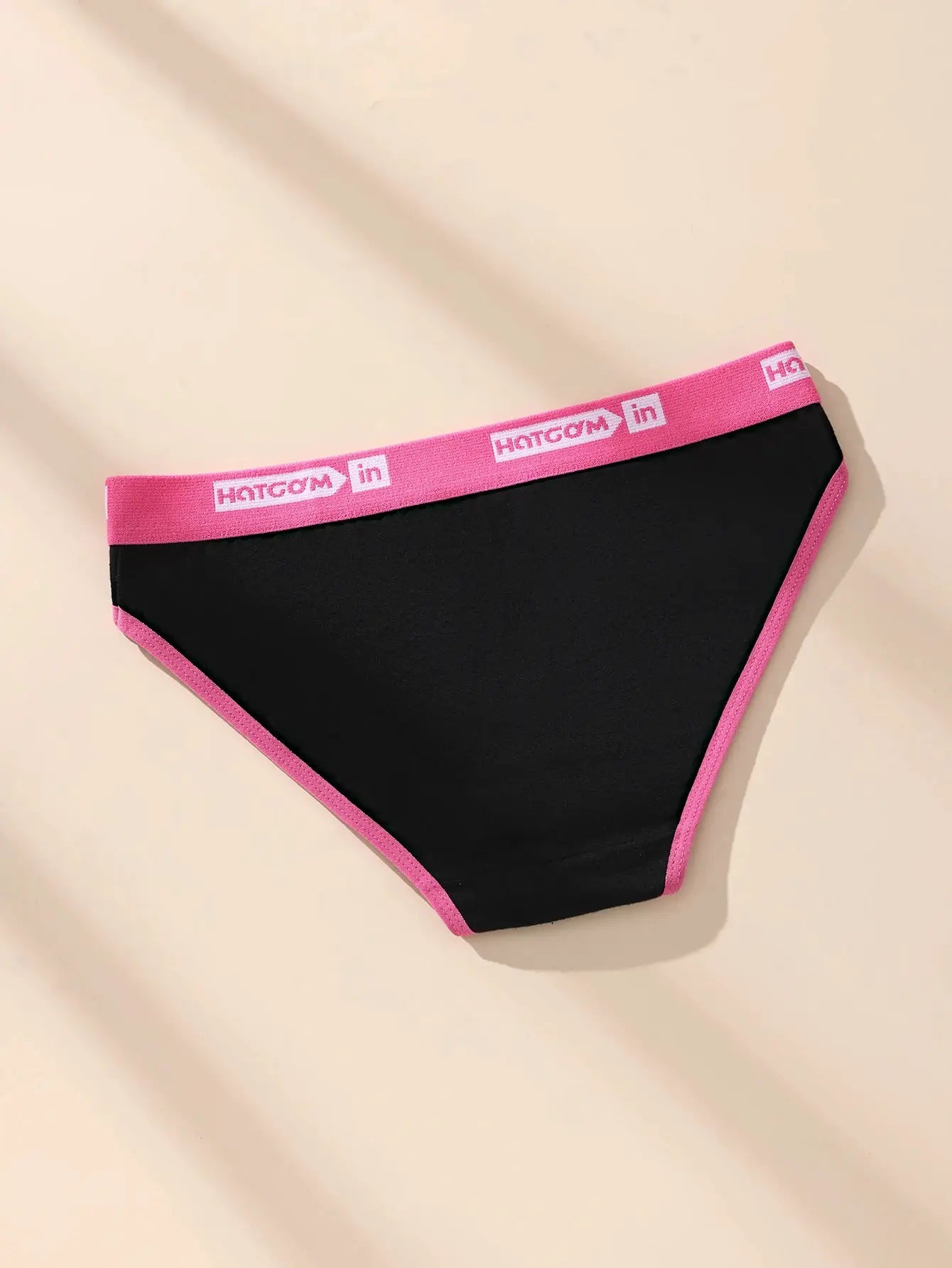 Women's black cotton panties with pink elastic waistband and pink trim, breathable stretch fabric