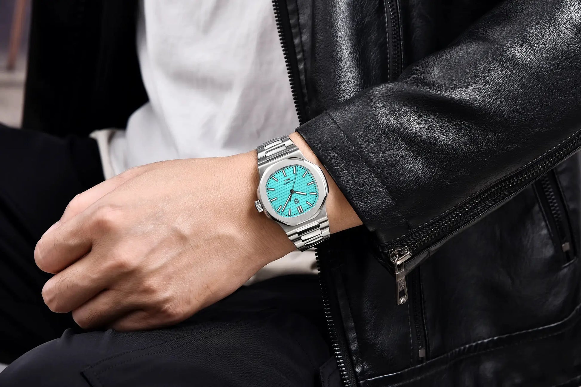 Pagani Design 40mm men's stainless steel automatic watch with turquoise dial on wrist