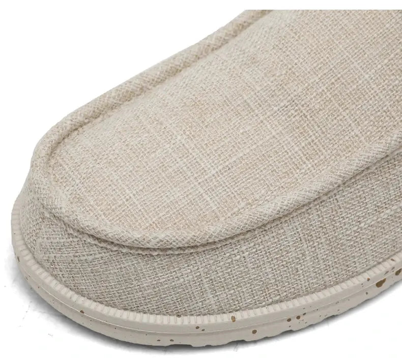 Men's beige canvas loafers for casual wear with breathable fabric and speckled sole