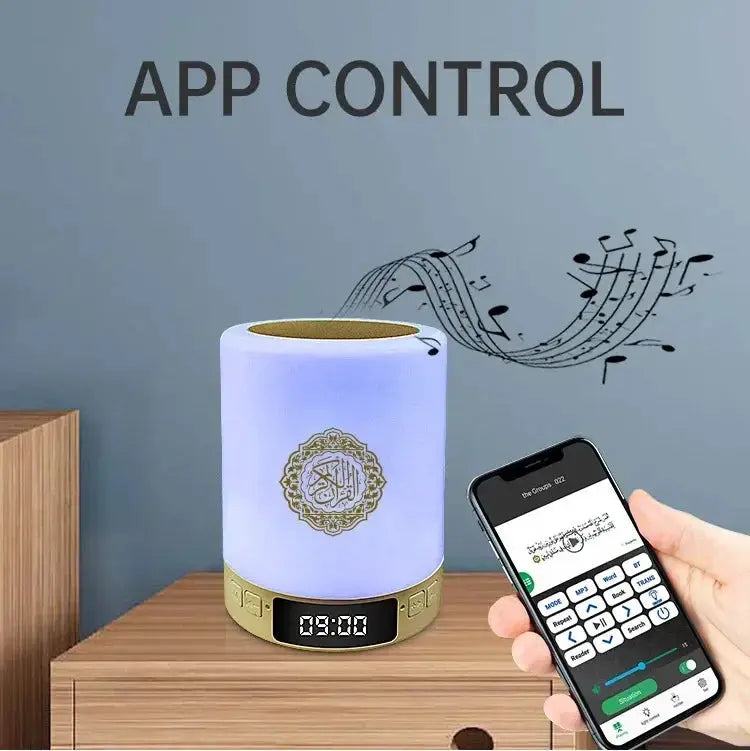 Portable cylindrical sound machine with LED night light and app-controlled Bluetooth speaker; white body with gold base