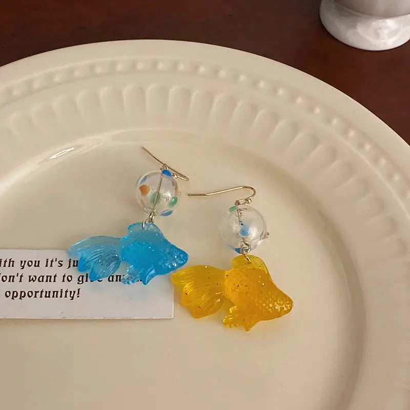 Pair of goldfish drop earrings in blue and yellow translucent fish charms with clear beads