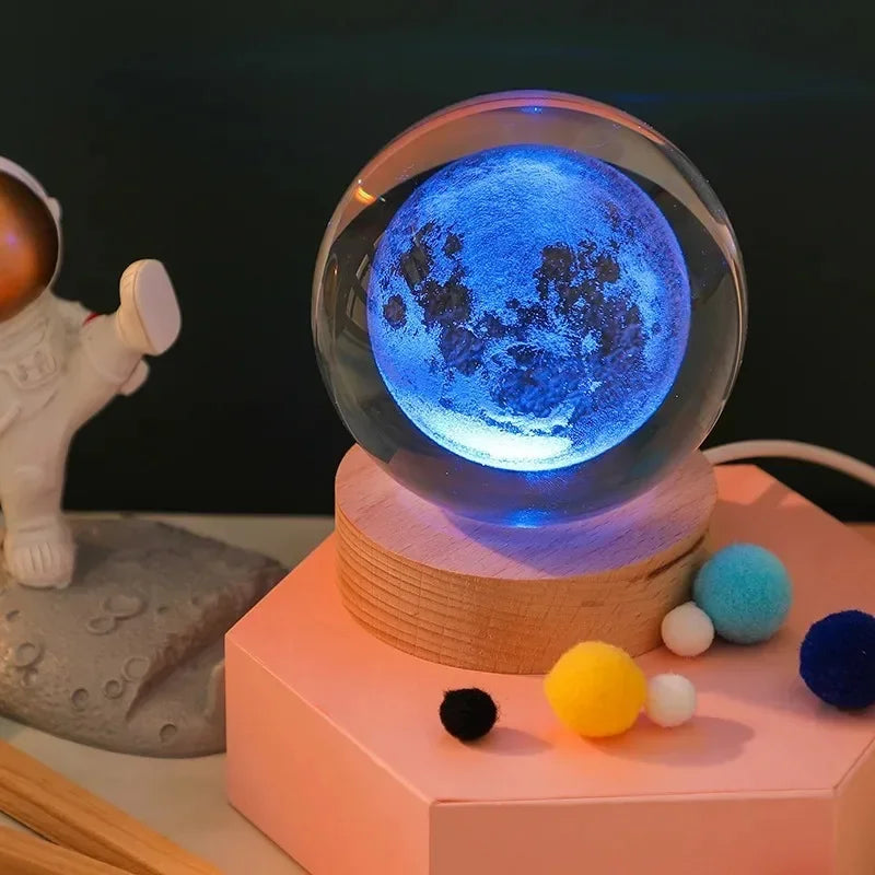 3D crystal ball night light with blue planet on wooden base from Simples Market for home decor