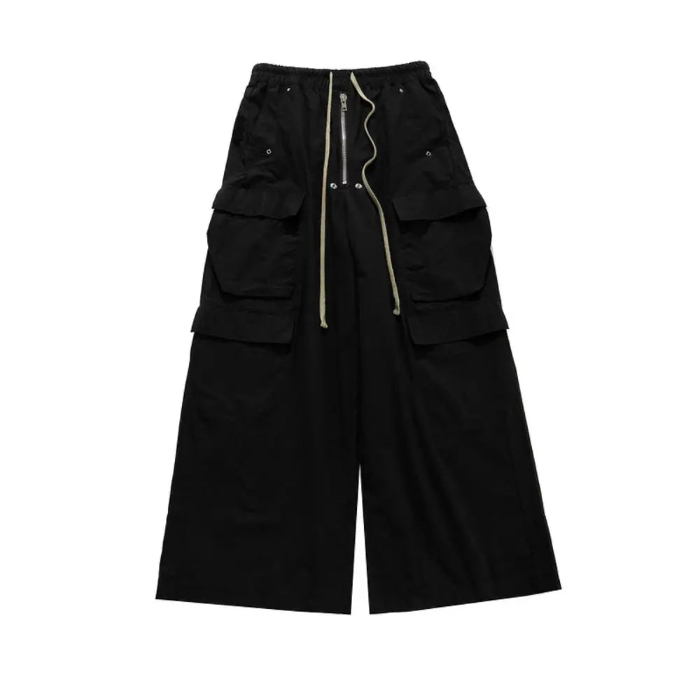 Owen Seak men's cargo pants in black with loose gothic fit, oversized cargo pockets and drawstring waist